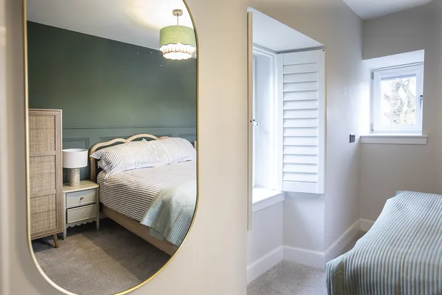 Bedroom two reflected in mirror